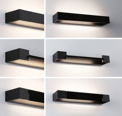 Black metal LED wall light with modern design and indirect lighting for living spaces.