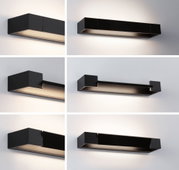 Black metal LED wall light with modern design and indirect lighting for living spaces.