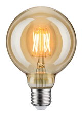 Round LED bulb with amber glass and visible filaments for decorative lighting and warm ambiance