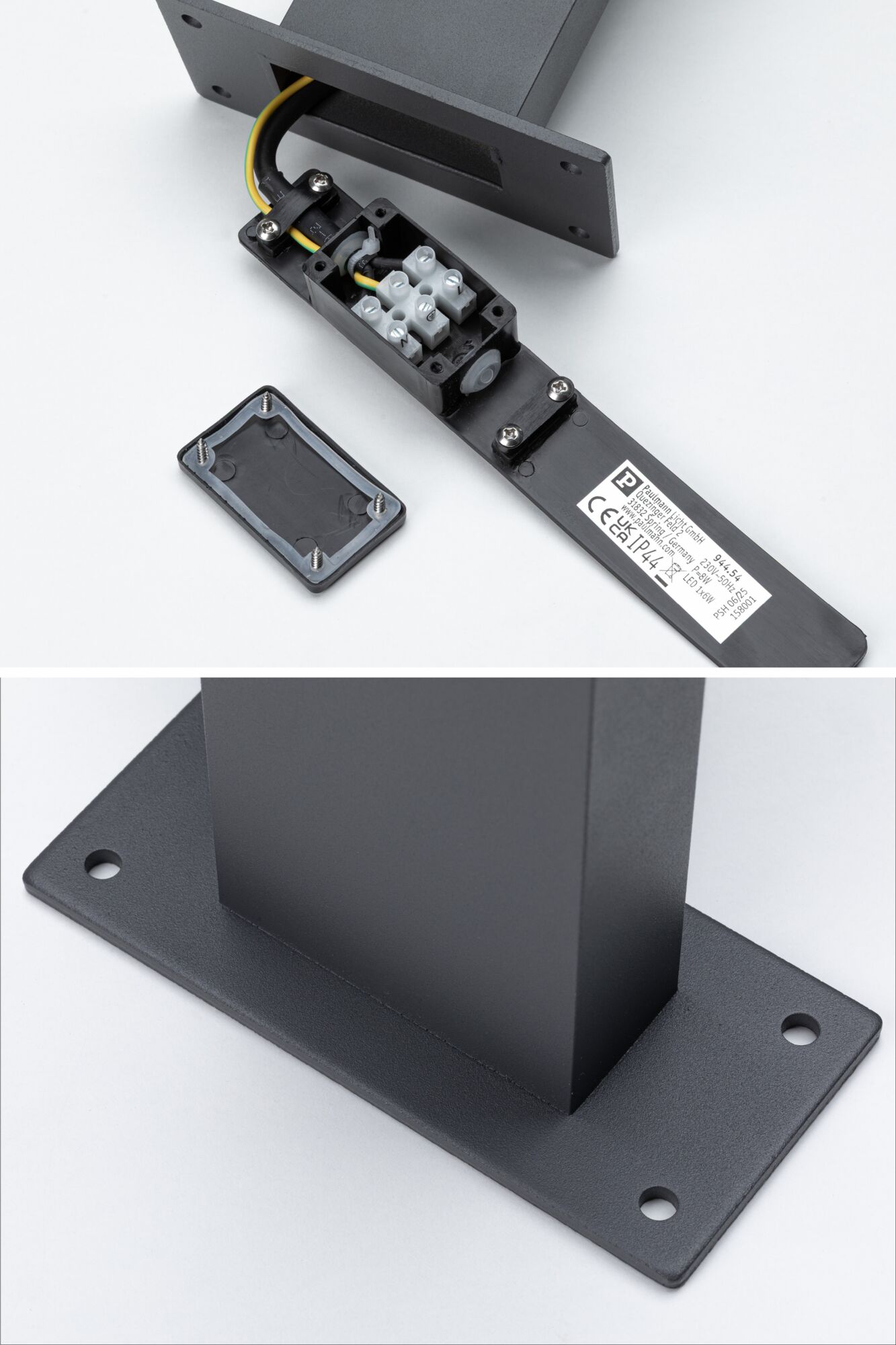 Black metal mounting with open terminal box and cable for LED lighting, base plate with screw holes