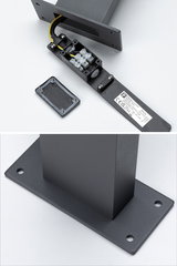 Black metal mounting with open terminal box and cable for LED lighting, base plate with screw holes