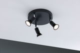 Black ceiling light with three adjustable metal spotlights for targeted room lighting.