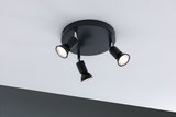 Black ceiling light with three adjustable metal spotlights for targeted room lighting.