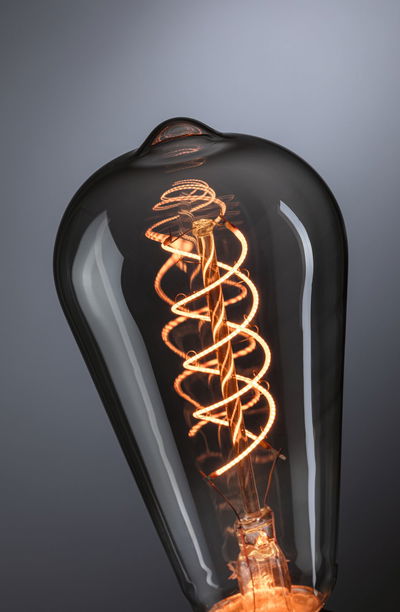 Vintage LED bulb with spiral filament glowing warm light for decorative lighting and ambiance