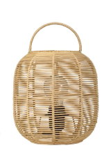 Round natural rattan table lamp with visible bulb and handle for cozy lighting in living spaces