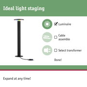 Black LED floor lamp with flat round head and cable connection for modern indoor lighting