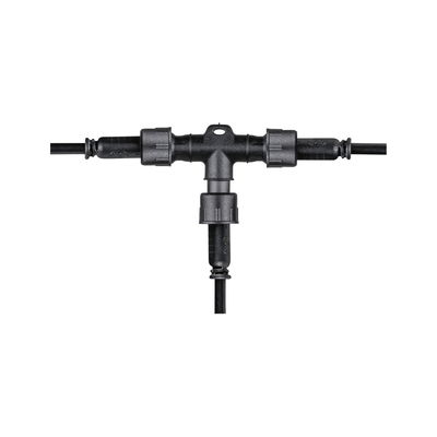 Black plastic T-connector with cable connections for outdoor electrical wiring and lighting setups