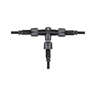 Black plastic T-connector with cable connections for outdoor electrical wiring and lighting setups