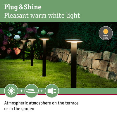 Modern garden lights with warm white light on black metal poles for atmospheric outdoor lighting