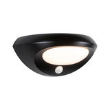 Black LED wall light with motion sensor and white diffuser for energy-efficient outdoor lighting
