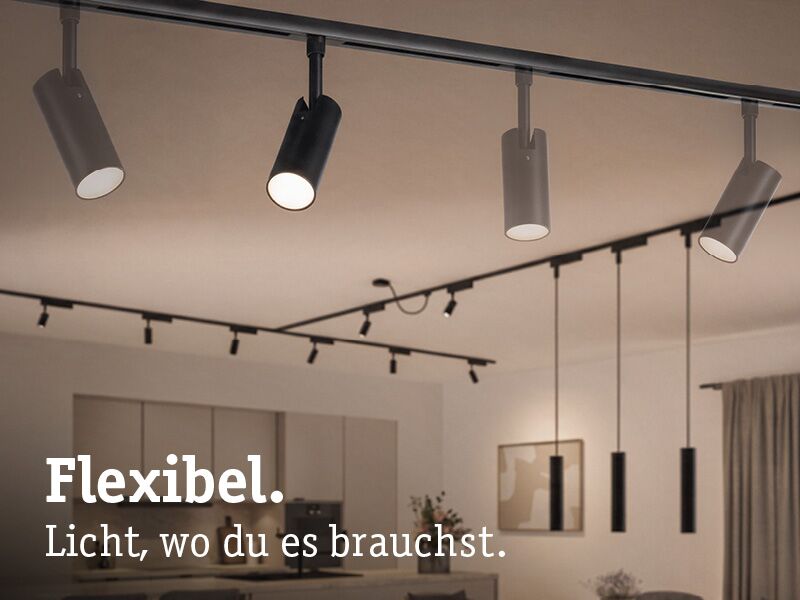 Schwarze und weiße LED-Schienenstrahler in moderner Küche für flexible Beleuchtungslösungen.