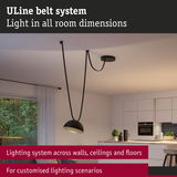 Black ULine belt system pendant light in modern living space for customizable lighting scenarios