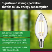 Energy-saving clear glass LED bulb with silver base highlighting significant energy savings.
