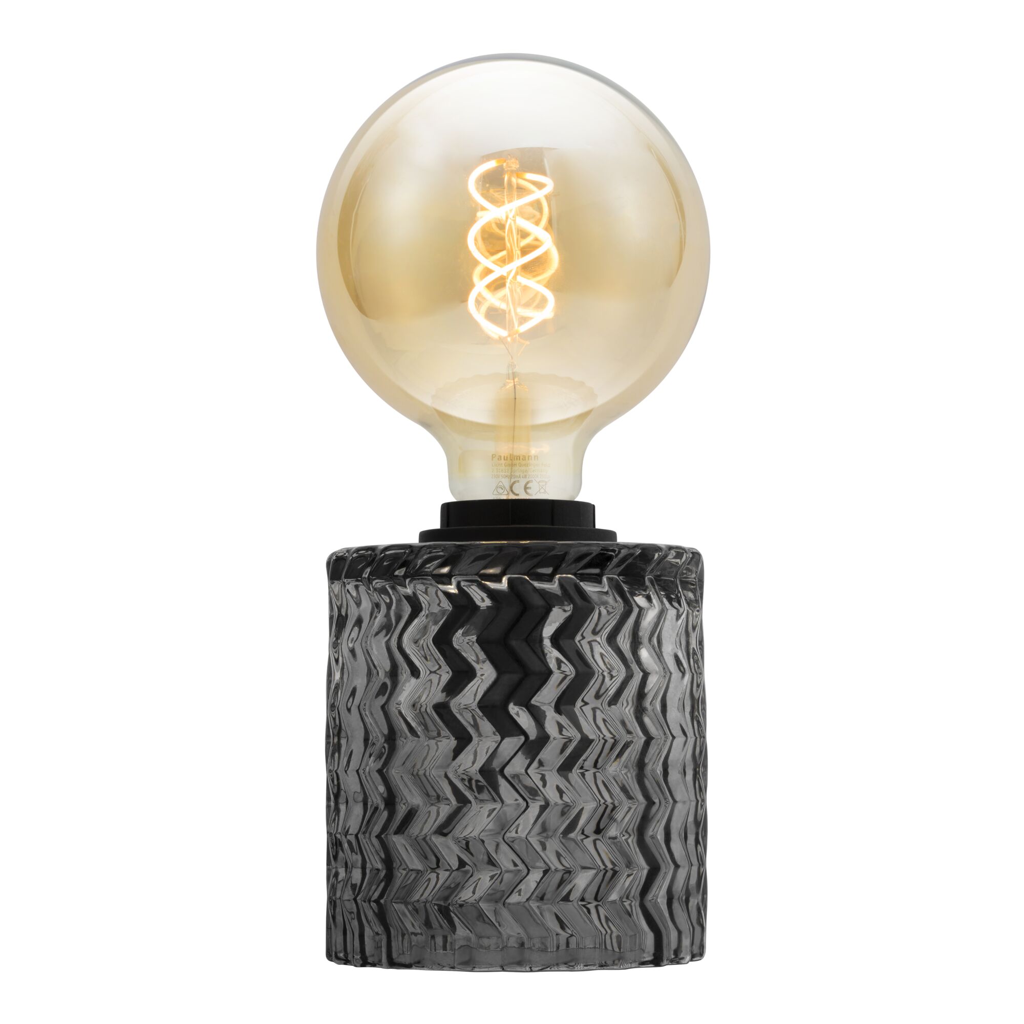 Table lamp with black textured glass base and large LED bulb for stylish home lighting