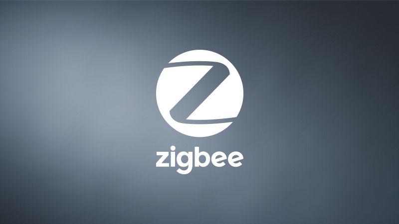 White Zigbee logo on blue-gray background representing smart home wireless technology.