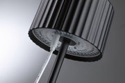 Black LED floor lamp shade with ribbed texture and visible cable connection for modern lighting design