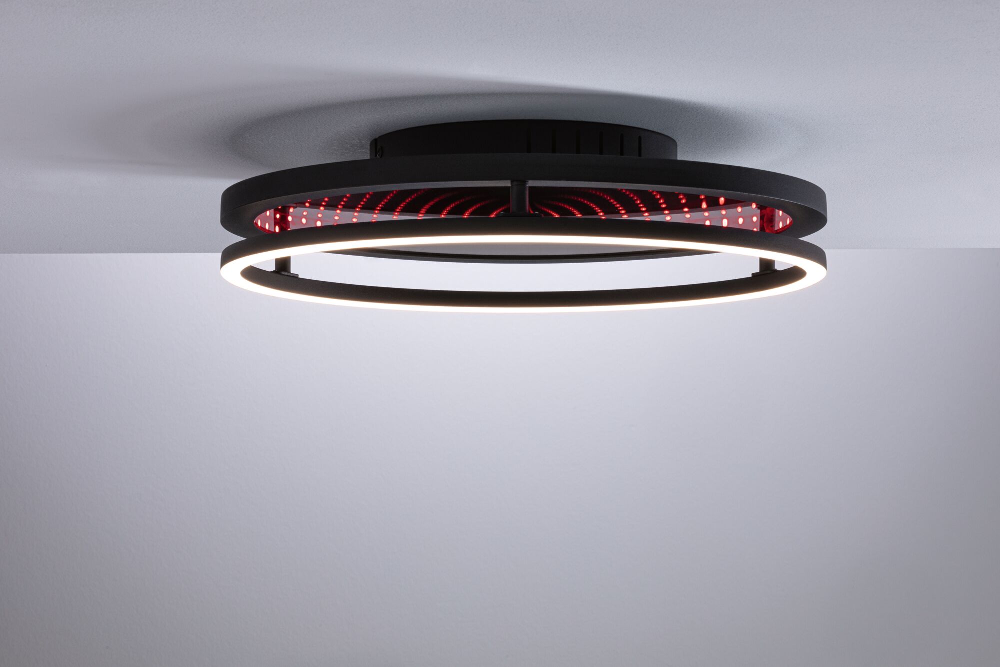 Modern black ceiling light with LED ring and red infinity mirror effect for stylish room lighting
