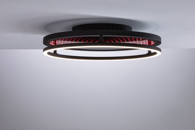 Plafonnier noir moderne avec anneau LED et effet miroir infini rouge pour un éclairage élégant