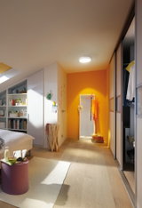 Modern bedroom with light wood floor, white furniture, and ceiling light providing warm illumination.