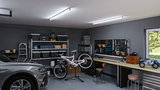 Garage moderne avec voiture grise, atelier vélo et éclairage LED au plafond pour un espace de travail lumineux