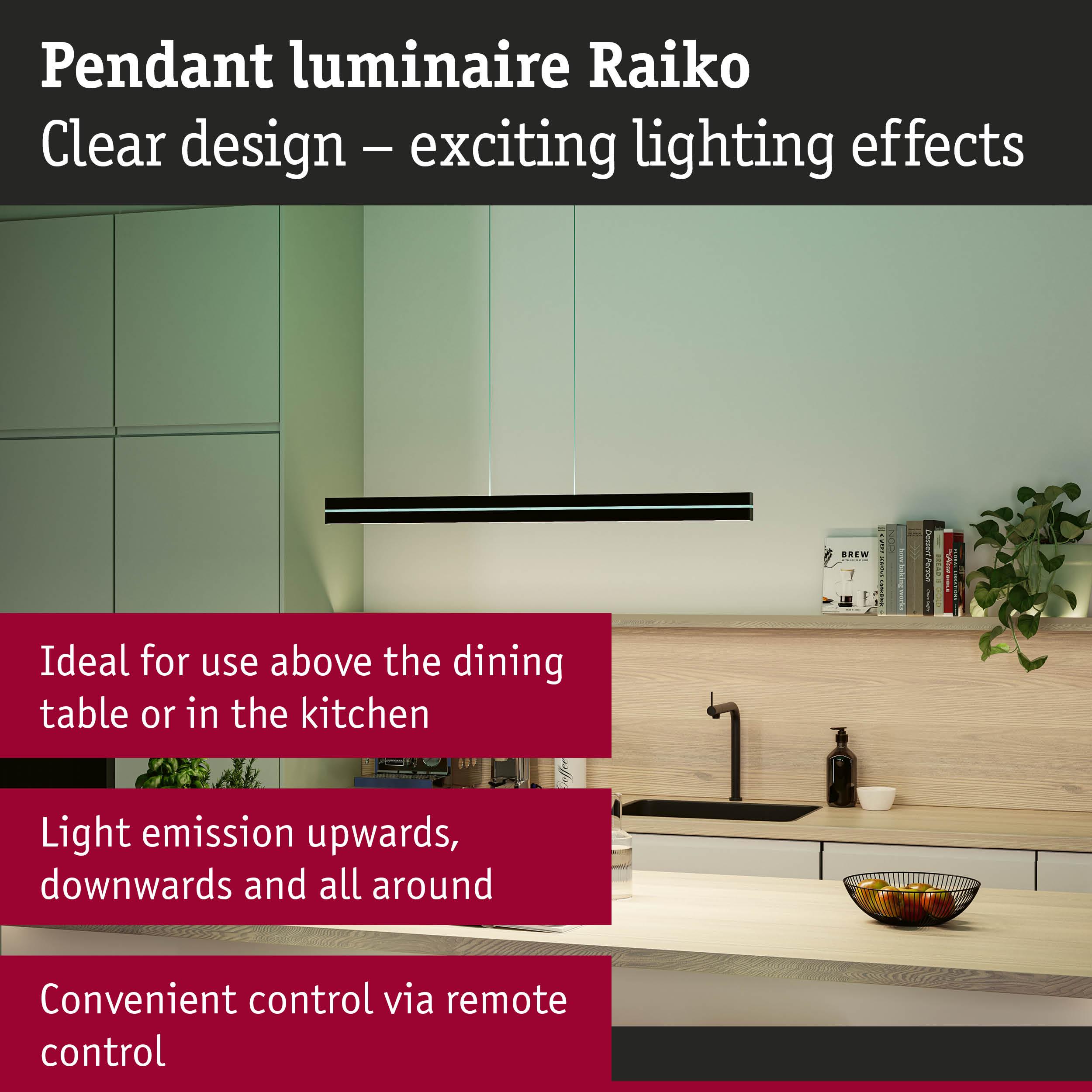 Black Raiko pendant light with clear design above light wood table in modern kitchen with LED lighting
