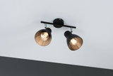 Black ceiling light with two adjustable metal spotlights and warm white light for living spaces.