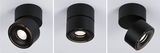 Three black metal ceiling spotlights with adjustable angle for modern indoor lighting solutions