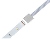 White LED strip with connector cable and four copper contacts for flexible lighting setups