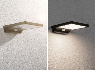Two modern plastic LED wall lights in brown and black with motion sensor for outdoor lighting.