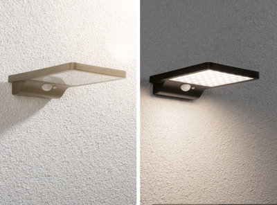 Twee moderne LED-wandlampen van kunststof in bruin en zwart met bewegingssensor voor buiten