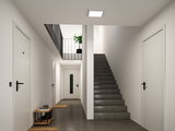 Modern stairwell with grey floor, white doors and square plastic ceiling light for indoor lighting