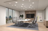 Modern conference room with grey office chairs and white table on grey carpet, LED ceiling lights