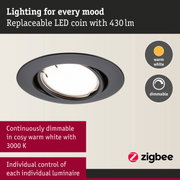 Black LED recessed spotlight with warm white light and dimmable feature for personalized lighting control.