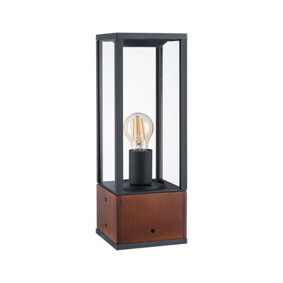 Moderne tafellamp met zwart metalen frame en houten voet, heldere glazen kap, zichtbare LED-lamp