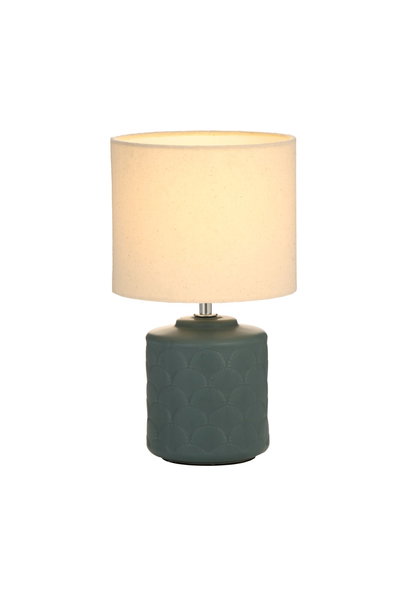 Table lamp with green ceramic base and cream fabric shade for cozy ambient lighting