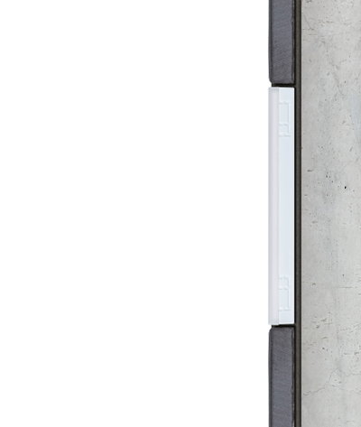 Cross-section of white LED light strip in modern wall installation with concrete and wood.
