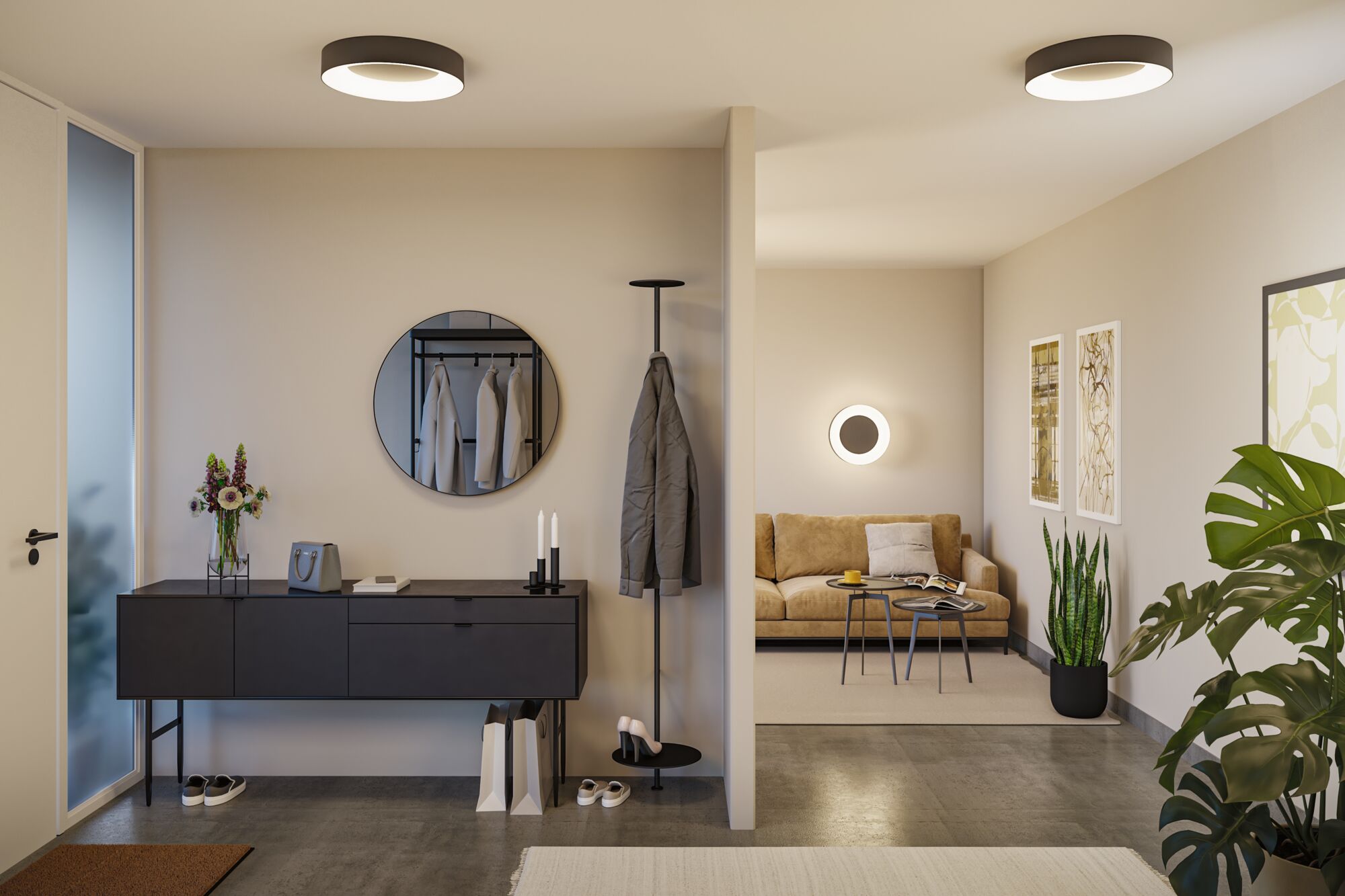 Modernes Wohnzimmer mit braunem Sofa, schwarzer Garderobe und runden Deckenleuchten in Schwarz und Weiß