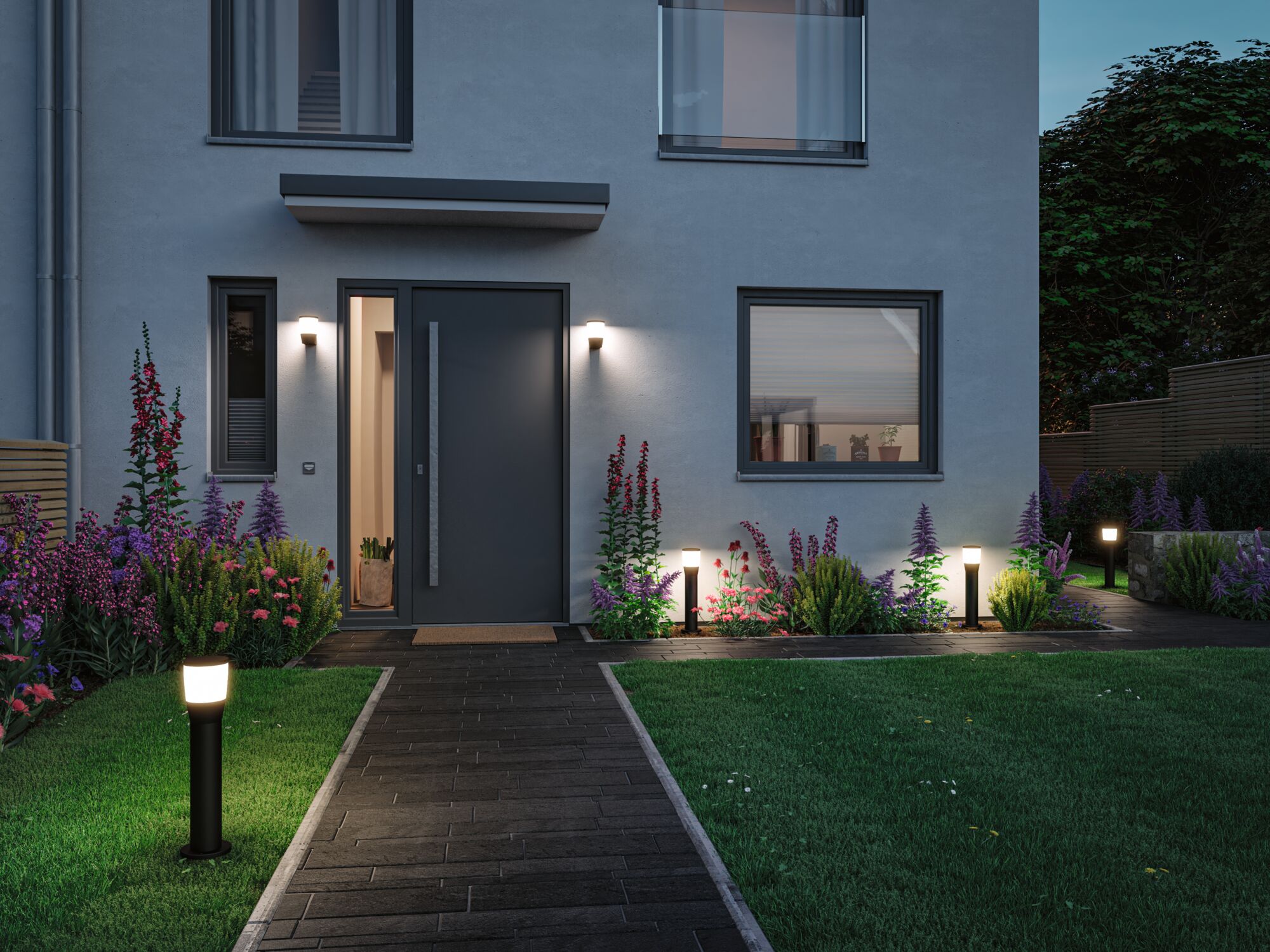 Modern outdoor lighting with black LED path lights and wall lamps on grey house with garden path.