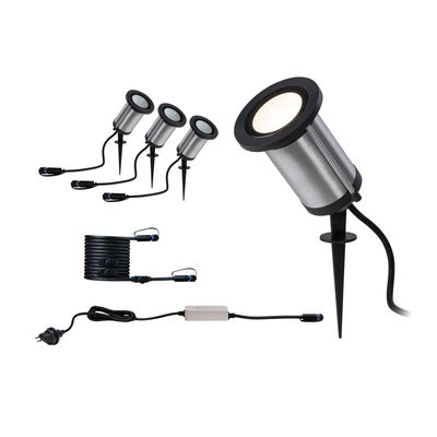 Set of four stainless steel garden spotlights with black ground spikes and cables for outdoor lighting