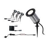 Set of four stainless steel garden spotlights with black ground spikes and cables for outdoor lighting