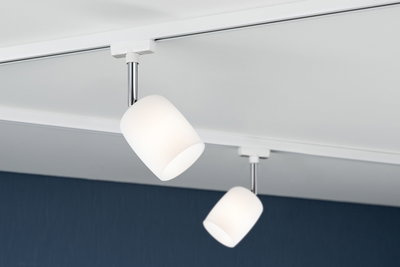 Two white glass ceiling spotlights with chrome rods on white track for modern indoor lighting