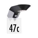 Applique LED noire en plastique avec détecteur de mouvement pour éclairage extérieur.