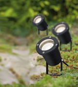 Black metal LED garden spotlights with adjustable base for outdoor lighting in green areas