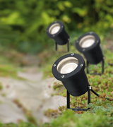 Black metal LED garden spotlights with adjustable base for outdoor lighting in green areas