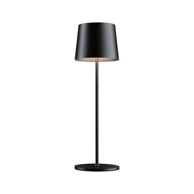 Black metal floor lamp with round base and cylindrical shade ideal for modern living spaces