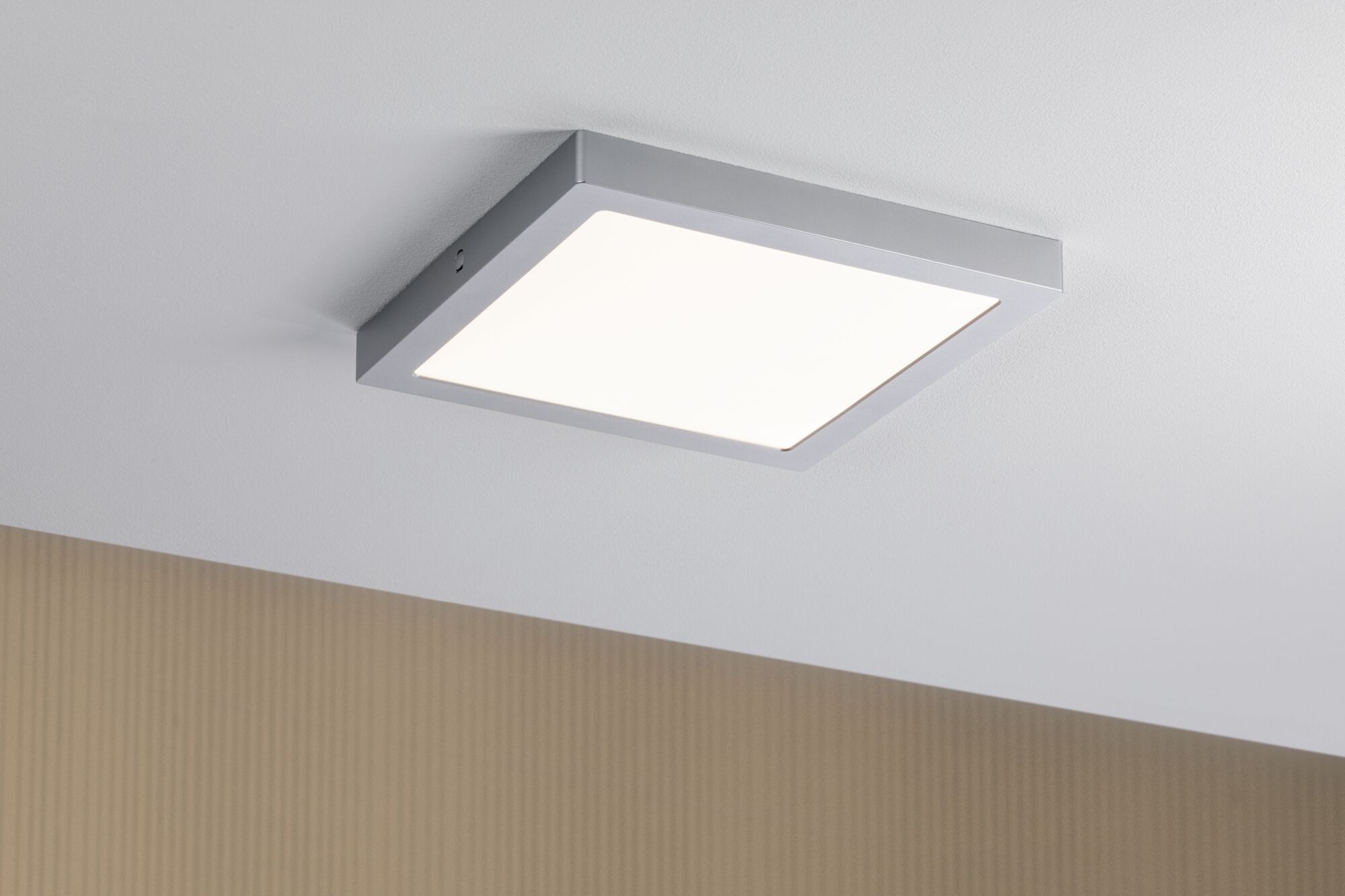 Square ceiling light with silver metal frame and white diffuser for modern interior lighting