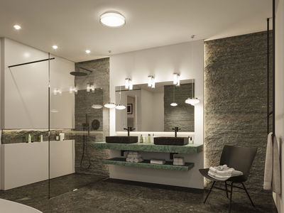 Modern bathroom with green marble vanity, black sinks, and indirect LED lighting for ambient effect