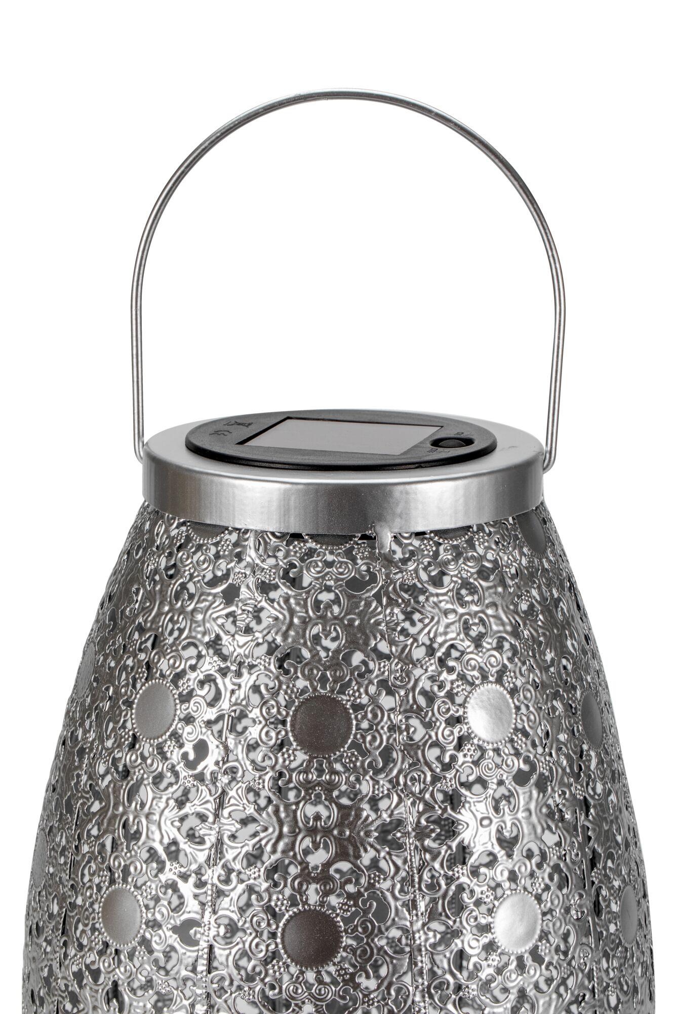 Metal lantern with intricate pattern and solar panel on top for energy-saving outdoor lighting