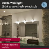 Luena wall light with adjustable light source in modern bathroom featuring green marble countertop