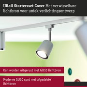 Moderne witte GU10 spot met afgedekte lichtbron aan railsysteem voor flexibele verlichting
